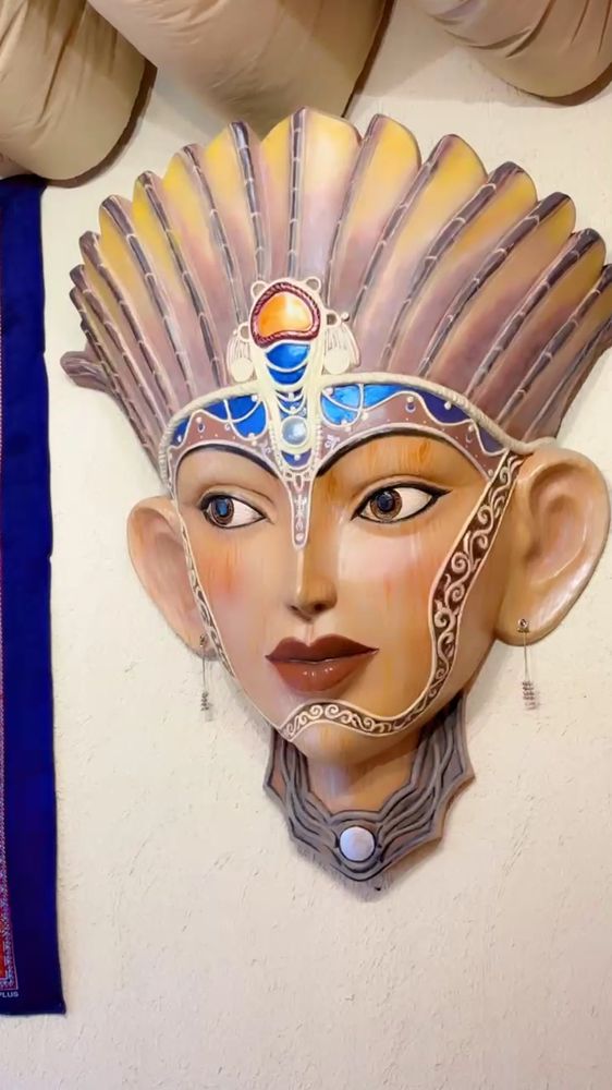 The painted mask on the wall at The Coffee Concept Bhopal